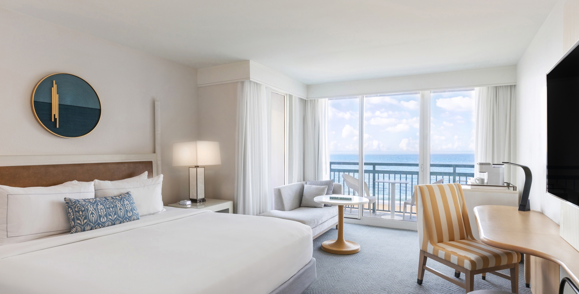 Spacious beachfront suite with panoramic ocean views and elegant decor at The Singer Resort in West Palm Beach