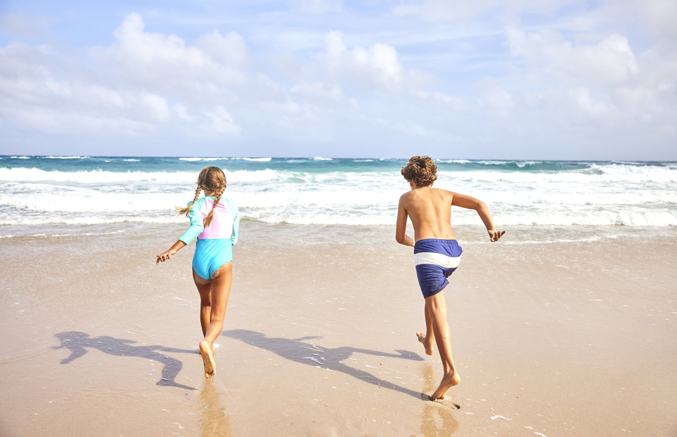 kids running towards the beach on singer island florida